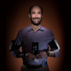 Michael Snyder, director of genomics and personalized medicine at Stanford, straps on a lot of wearables in his hunt to see if they can help detect infectious diseases early.